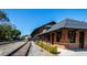 Exterior view of the train station with train tracks, train cars, and greenery at 379 Morgan Rd, Carrollton, GA 30116