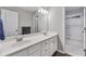 Double sink bathroom vanity with white cabinets and views of the shower/tub combo at 4045 Bridle Ridge Dr, Suwanee, GA 30024