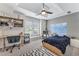 Comfortable bedroom with tray ceilings, natural light and a dedicated study area at 4045 Bridle Ridge Dr, Suwanee, GA 30024