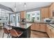 Open kitchen with stainless appliances, granite countertops, center island with bar seating, and a breakfast area at 4045 Bridle Ridge Dr, Suwanee, GA 30024