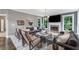 Bright living room with fireplace, large windows, and stylish decor, perfect for relaxing or entertaining at 4045 Bridle Ridge Dr, Suwanee, GA 30024