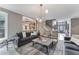 Comfortable living room with a view into the entryway, and modern decor throughout at 4045 Bridle Ridge Dr, Suwanee, GA 30024