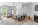 Spacious main bedroom with vaulted ceiling, multiple windows, ceiling fan, fireplace, and neutral decor at 4045 Bridle Ridge Dr, Suwanee, GA 30024