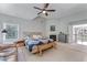 Large main bedroom features sitting area, fire place, ceiling fan, and ensuite bathroom at 4045 Bridle Ridge Dr, Suwanee, GA 30024