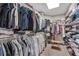 Spacious walk-in closet with organized shelving and hanging space for ample storage at 4045 Bridle Ridge Dr, Suwanee, GA 30024