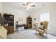 Cozy bedroom features a ceiling fan, carpet, and natural light at 5744 Cypress Bluff Ln, Hoschton, GA 30548