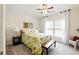 Bright bedroom features carpeted floors, large window, and neutral decor at 5744 Cypress Bluff Ln, Hoschton, GA 30548
