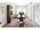 Inviting dining area features hardwood floors, a large window, and plenty of natural light at 5744 Cypress Bluff Ln, Hoschton, GA 30548