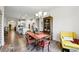Bright dining area with hardwood floors offers a view of the kitchen and living spaces at 5744 Cypress Bluff Ln, Hoschton, GA 30548