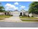 Charming single-Gathering home with a two-car garage, well-manicured lawn, and inviting curb appeal at 5744 Cypress Bluff Ln, Hoschton, GA 30548