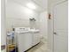 Laundry room with modern washer and dryer at 5744 Cypress Bluff Ln, Hoschton, GA 30548