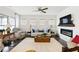 Cozy living room features a fireplace, comfortable seating, and plenty of natural light at 5744 Cypress Bluff Ln, Hoschton, GA 30548