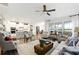 Bright and open living space with hardwood floors, neutral decor, and lots of natural light at 5744 Cypress Bluff Ln, Hoschton, GA 30548