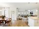 Open concept living space featuring a dining area, living room, and modern kitchen at 5744 Cypress Bluff Ln, Hoschton, GA 30548