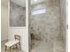 This shower stall features tile walls, a shower head, and a built in seat at 5744 Cypress Bluff Ln, Hoschton, GA 30548
