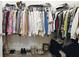 A walk-in closet shows organized racks of clothing and shoes at 5744 Cypress Bluff Ln, Hoschton, GA 30548
