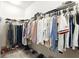 A walk-in closet shows organized racks of clothing and shoes at 5744 Cypress Bluff Ln, Hoschton, GA 30548