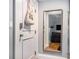 Entryway with decorative mirror and view into the living room at 61 16Th Ne St # 4, Atlanta, GA 30309