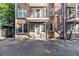 Three-story brick building features balconies, rear entrances, and convenient parking at 61 16Th Ne St # 4, Atlanta, GA 30309