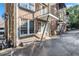 Brick building exterior view features a private balcony and easy access to covered parking at 61 16Th Ne St # 4, Atlanta, GA 30309