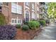 A classic building entrance with meticulously maintained landscaping adding to its curb appeal at 61 16Th Ne St # 4, Atlanta, GA 30309