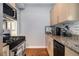 Charming kitchen with granite countertops, stainless steel appliances, and ample cabinet space at 61 16Th Ne St # 4, Atlanta, GA 30309
