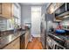 Functional kitchen with granite countertops, stainless steel appliances, and ample storage at 61 16Th Ne St # 4, Atlanta, GA 30309