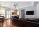 Open-concept living room featuring a ceiling fan and views of the dining area at 61 16Th Ne St # 4, Atlanta, GA 30309