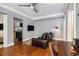 Inviting living room with hardwood floors, a leather sofa, and an open doorway to the kitchen at 61 16Th Ne St # 4, Atlanta, GA 30309