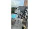 Stunning aerial view of the condo complex, showcasing the pool, lounge areas, and modern architectural design at 775 Juniper Ne St # 612, Atlanta, GA 30308