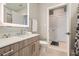 This stylish bathroom showcases a modern vanity, a sleek mirror, and convenient access to storage at 775 Juniper Ne St # 612, Atlanta, GA 30308