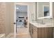 A bathroom with stylish vanity with granite counters and a tiled shower that is viewed from the bedroom at 775 Juniper Ne St # 612, Atlanta, GA 30308