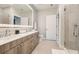 Spacious bathroom with double vanity, modern fixtures, and a walk-in shower, designed for comfort and style at 775 Juniper Ne St # 612, Atlanta, GA 30308