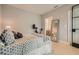 This bedroom offers a neutral color scheme, a large mirror and a conveniently located exercise bike at 775 Juniper Ne St # 612, Atlanta, GA 30308