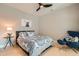 Cozy bedroom with a patterned bedspread, a modern chair, and natural light, creating a relaxing ambiance at 775 Juniper Ne St # 612, Atlanta, GA 30308