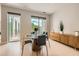 Charming dining room with modern accents, textured wall, and a view of the outside balcony at 775 Juniper Ne St # 612, Atlanta, GA 30308