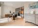 Cozy dining area with modern decor, stylish furniture, textured wall and natural light from balcony at 775 Juniper Ne St # 612, Atlanta, GA 30308