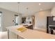 Bright kitchen featuring stainless steel appliances, a large island with sink, and modern lighting fixtures at 775 Juniper Ne St # 612, Atlanta, GA 30308