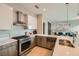 Well-equipped kitchen with stainless steel appliances, tile backsplash, modern cabinets, and open to the living area at 775 Juniper Ne St # 612, Atlanta, GA 30308