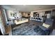 Spacious living room with modern furnishings, open layout, and access to a fully equipped kitchen area at 775 Juniper Ne St # 612, Atlanta, GA 30308
