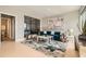 Stylish living room showcases a teal sofa, modern artwork, chic furnishings and light hardwood flooring at 775 Juniper Ne St # 612, Atlanta, GA 30308