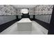 Well-lit mailroom featuring modern light fixture, bird-themed wallpaper, and secure mailboxes for residents at 775 Juniper Ne St # 612, Atlanta, GA 30308