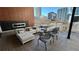 Stylish outdoor patio with fireplace and lounge seating, offering city views and a cozy atmosphere at 775 Juniper Ne St # 612, Atlanta, GA 30308