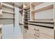 Organized walk-in closet featuring custom shelving, drawers, and ample space for storage, perfect for any wardrobe at 775 Juniper Ne St # 612, Atlanta, GA 30308