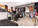 Basement featuring a work out area with treadmill, desk and expansive closet at 9155 Nesbit Ferry Rd, Alpharetta, GA 30022