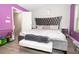 Spacious bedroom featuring a plush upholstered bed and a calming, coordinated color scheme at 9155 Nesbit Ferry Rd, Alpharetta, GA 30022