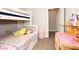 bedroom with a bunkbed, desk, and ample storage, creating a functional and fun space at 9155 Nesbit Ferry Rd, Alpharetta, GA 30022