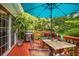 Covered deck with a grill and seating at 9155 Nesbit Ferry Rd, Alpharetta, GA 30022