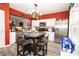 Stylish kitchen featuring stainless steel appliances, hardwood flooring and a decorative chandelier at 9155 Nesbit Ferry Rd, Alpharetta, GA 30022