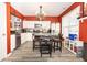 Bright kitchen featuring stainless steel appliances, hardwood flooring and a decorative chandelier at 9155 Nesbit Ferry Rd, Alpharetta, GA 30022